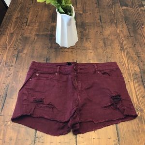 Burgundy studded jean shorts